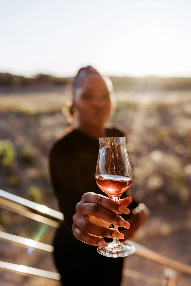 Glass raised in Namibian sunlight